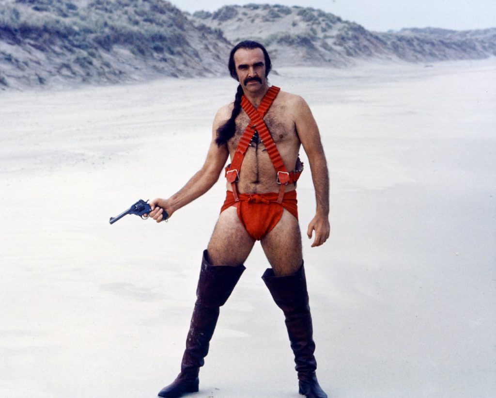 The marvelous Sean Connery in a red diaper and badoliers with thigh-high boots